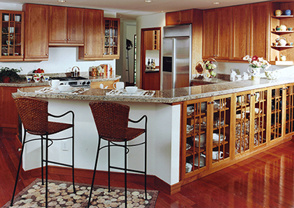 Kitchen design by Stephen Charlip Architect tailored to our client’s lifestyle.  Wrap around serving counter and custom designed cabinetry to match the house architectural details.