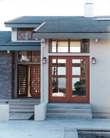 This is a design in which the interior spaces create a perfect balance between inside and out. Glass doors and windows open to a wrap around veranda where summer breezes cool the house interior spaces.